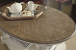 Realyn Two-Tone Wood Oval Coffee Table