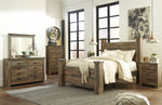 Trinell Brown Wood Queen Poster Bed