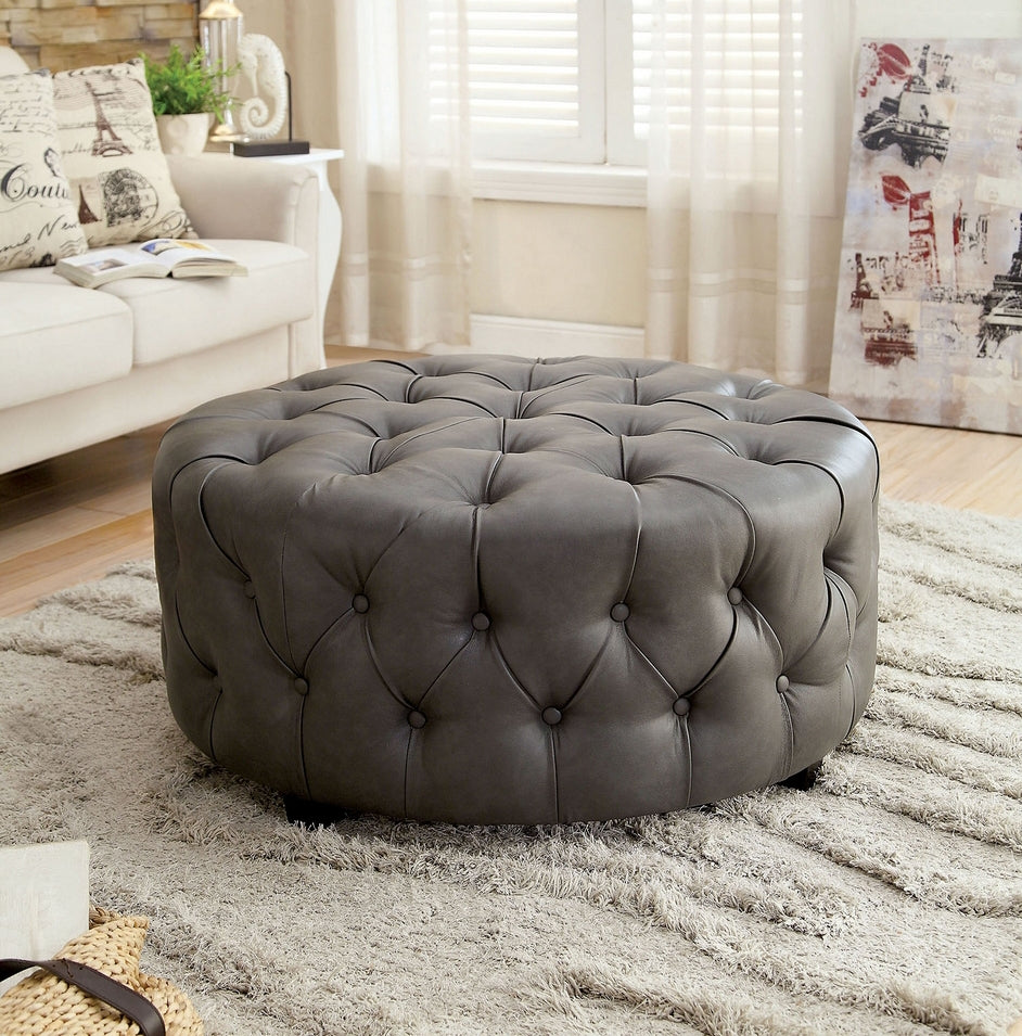 Latoya Round Gray Bonded Leather Ottoman